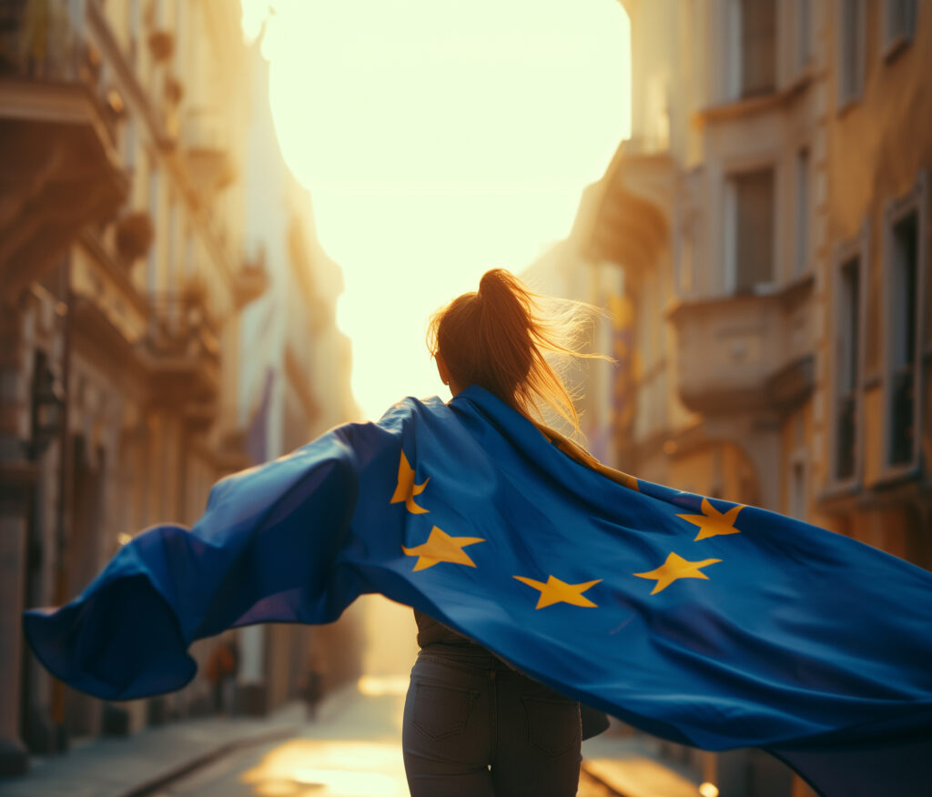 Ragazza che cammina verso il sole con bandiera europea